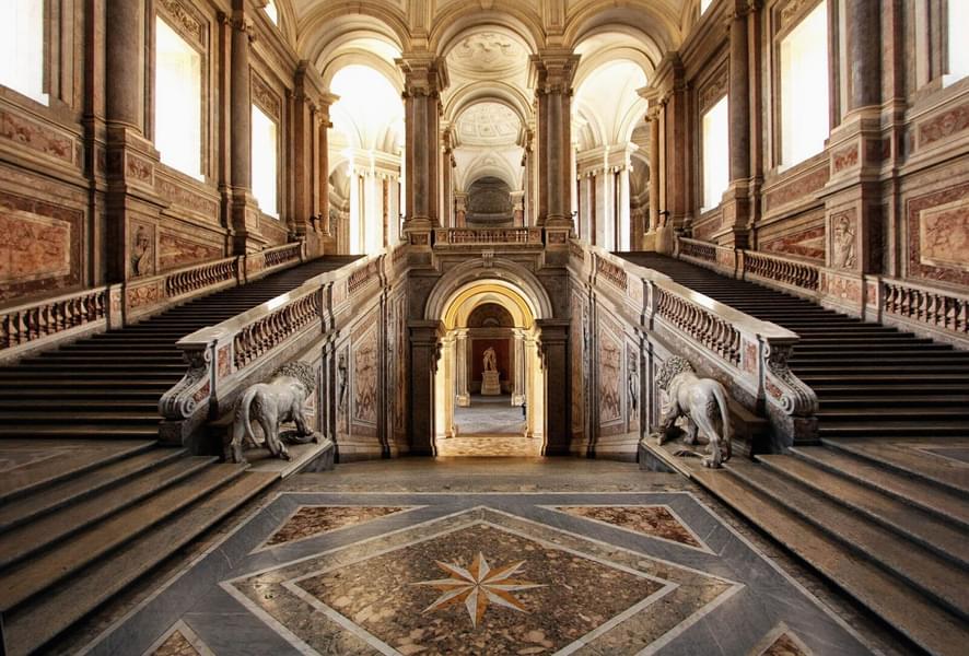 Feel like a royalty as you walk down the Scala Regia, a majestic staircase in the Royal Palace of Caserta