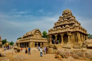 Tourist admiring the archtecture of the Shore temple in Mahabalipuram