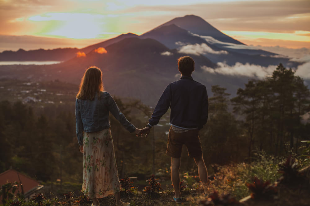 Couple enjoying the view of Mount Batur, Bali