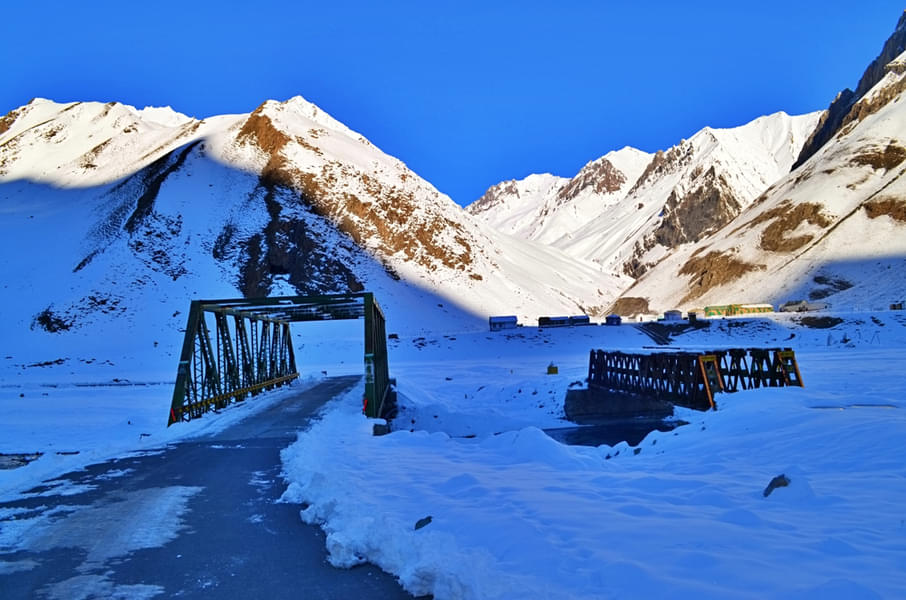 Drive through the captivating Zoji La pass, and admire the beautiful snow covered hills in the surrounding