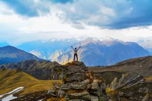Marvel at the snow capped peaks from the top of Gorson Bugyal