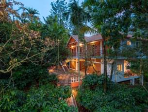 Outside View of Homestay surrounded by lush greenery