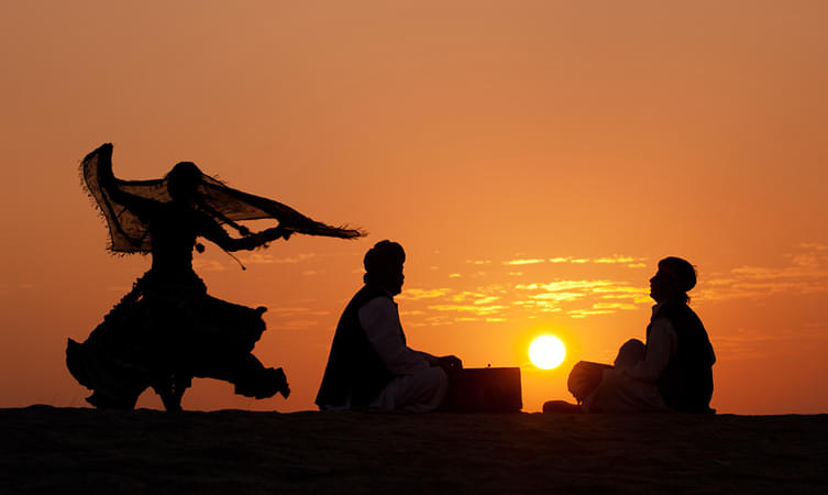 Happiness is watching the sun rise in the distand horizon for beyond the sand dunes amidst the pleasant breeze and surprised camels