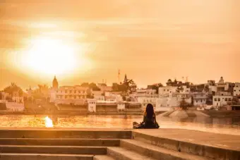 Girl admiring the stunning sunset at Pushkar Lake