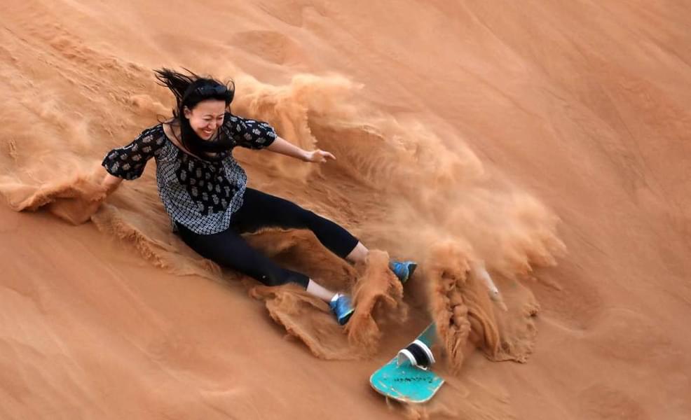 Opt for sand boarding there to feel the Arabian sand.