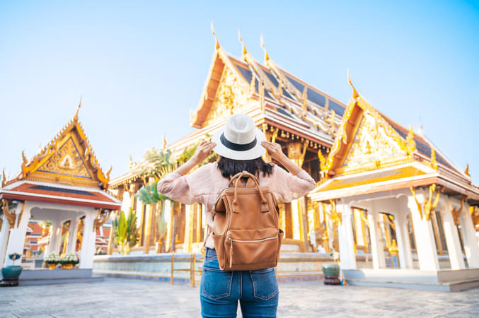 Tourist admiring the beautiful Emerald Buddha Temple