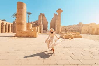 Woman admiring the ruins of the ancient Karnak temple