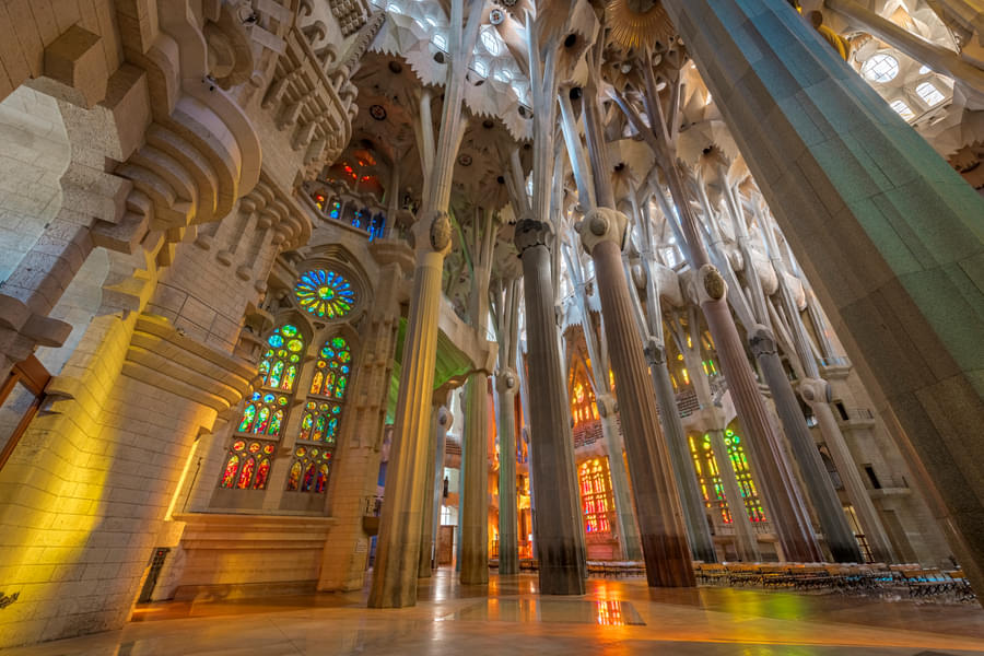 Stained glass windows and towering arches of the basilica