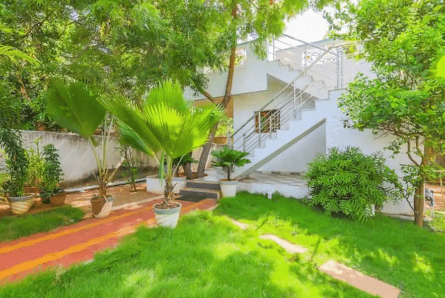 A Serene Villa Amidst Lush Green Gardens In Pondicherry Image