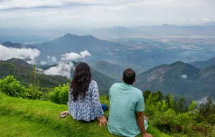 Couple admiring views from Chikmagalaur hill top