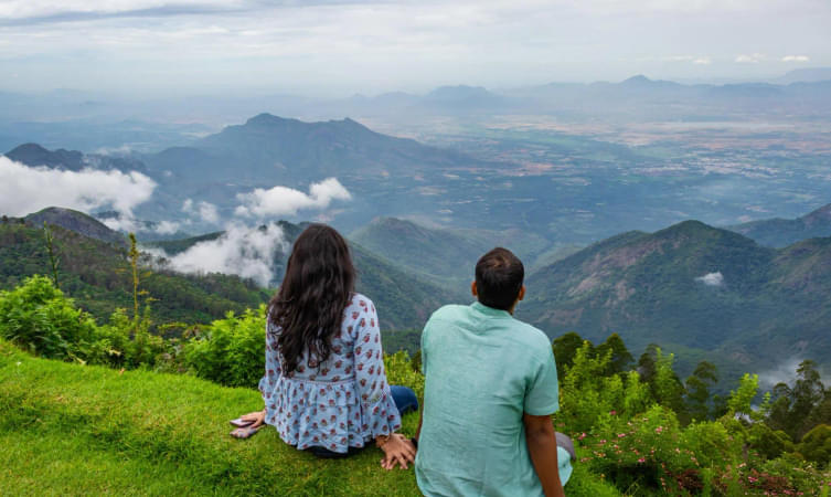 Couple admiring views from Chikmagalaur hill top