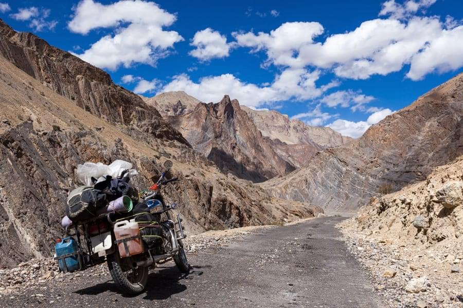 Ride your bike which is surrounded by towering peaks and vast expanses of untouched natural beauty