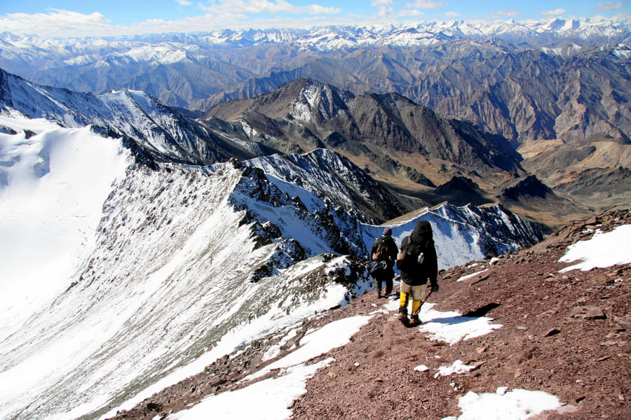 trekking on the ridgeline towards summit