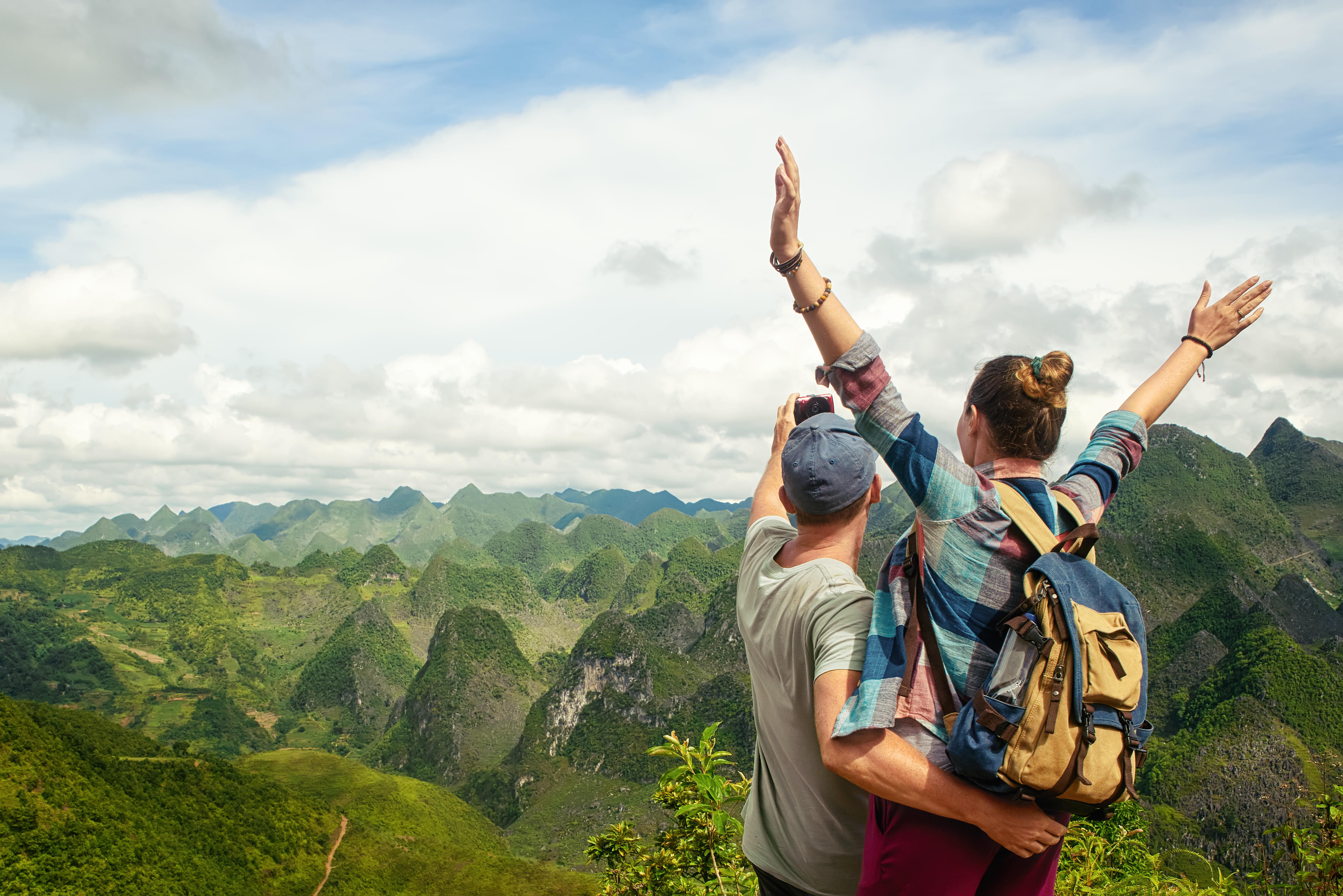 Couple admiring karst mountains in Vietnam