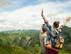 Couple admiring karst mountains in Vietnam