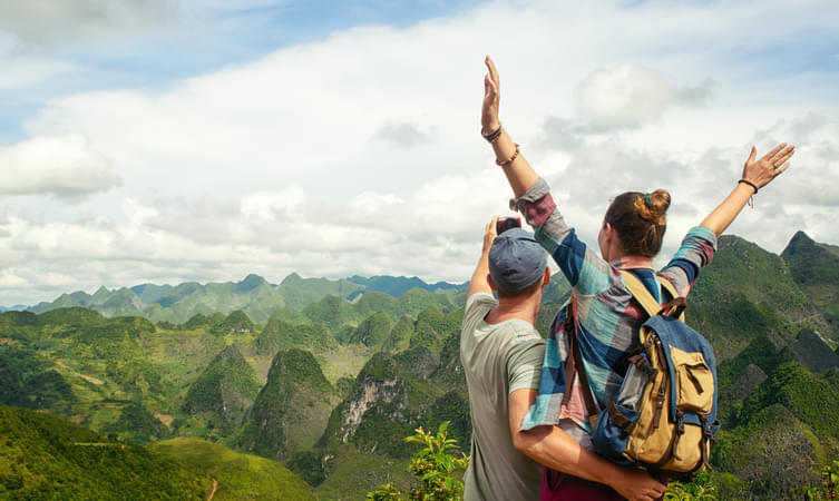 Couple admiring karst mountains in Vietnam