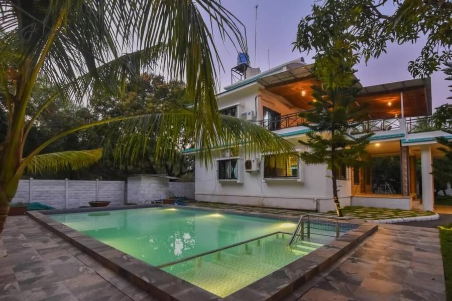 A Cozy Getaway Amidst Dense Palm Trees In Alibaug Image