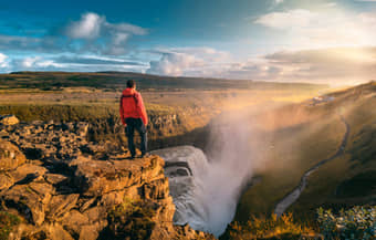 Visitor admiring the stunning view of the Gullfoss Falls