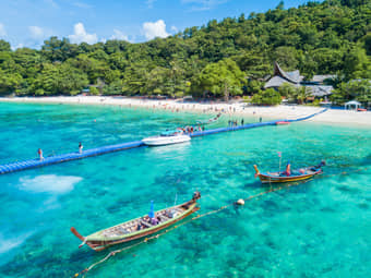 Boats at the beautiful Coral Island, Thailand