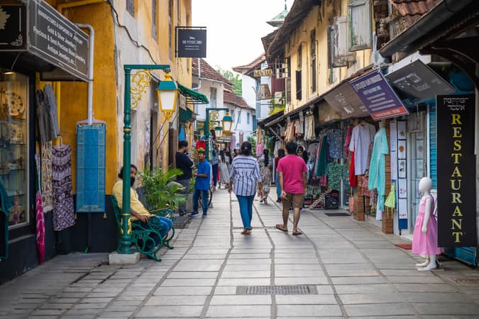 Explore Kochi’s vibrant markets filled with spices, antiques, and local crafts