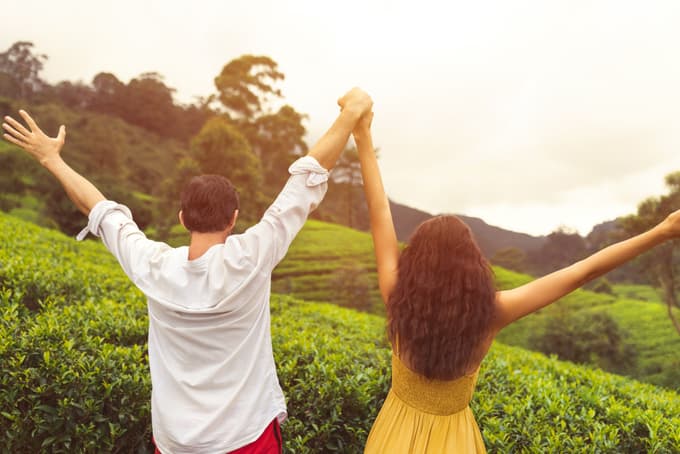 Couple enjoying in the lush green hills of Munnar