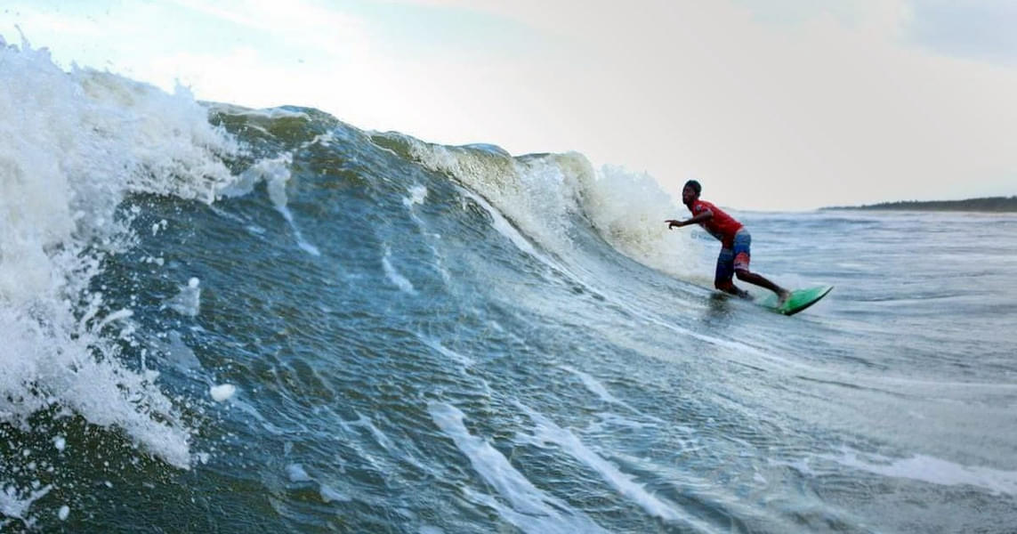 Surf Through Thrilling Waves In Pondicherry Image