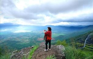 Gaze out at sprawling spice plantations and forested peaks