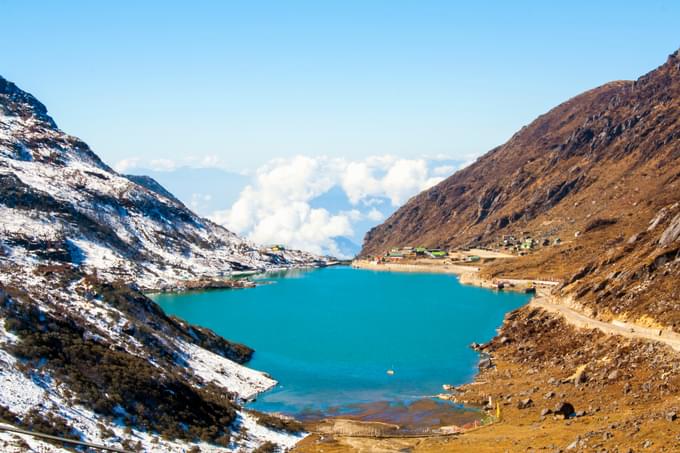 Marvel at the beauty of the oval shaped Tsomgo Lake 