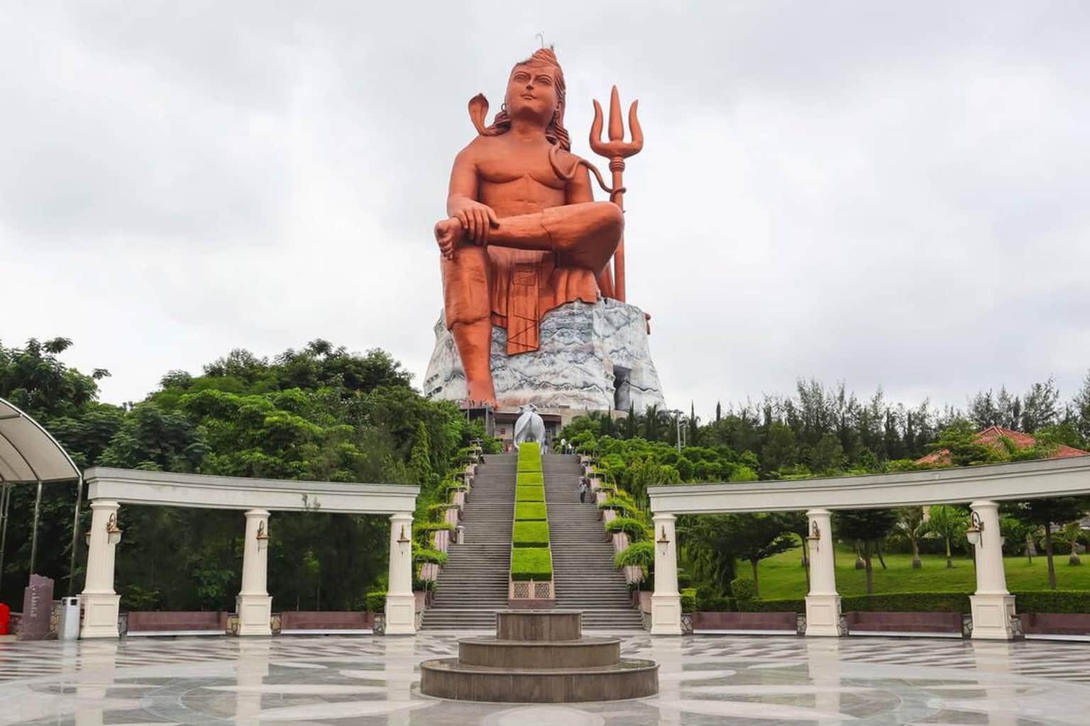 Experience divine serenity as you stand before the majestic Lord Shiva statue