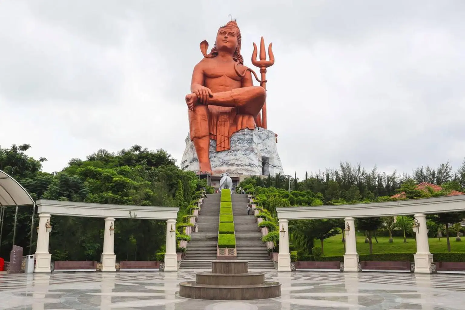 Experience divine serenity as you stand before the majestic Lord Shiva statue