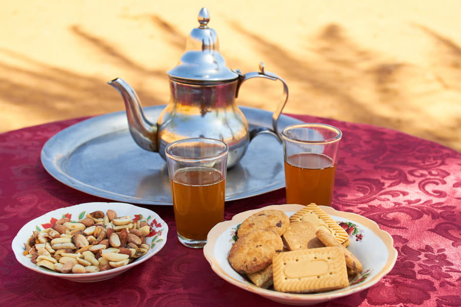 Family Dinner with Jain Food on Dunes Image