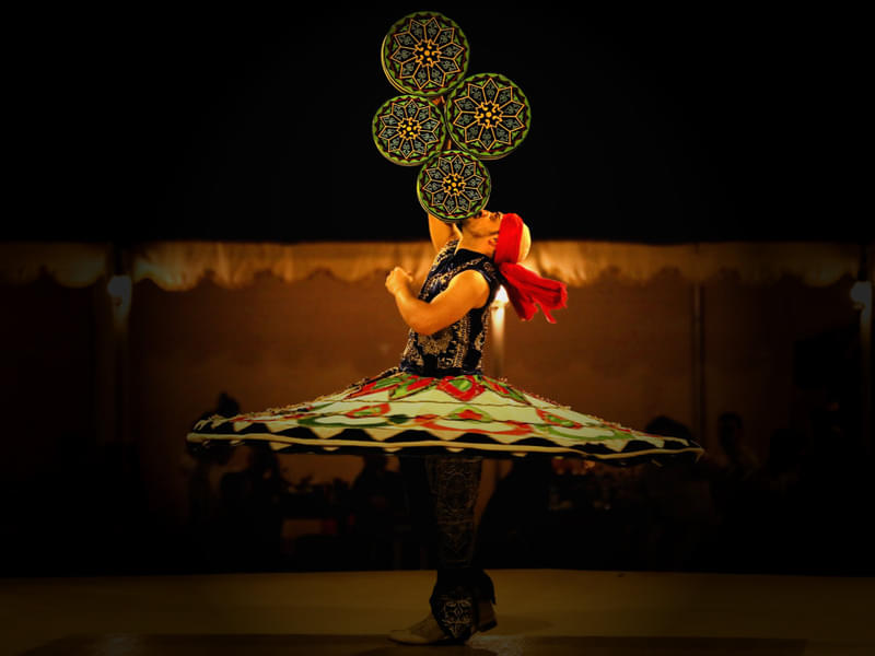 Enjoy a mesmerizing "Tanura dance" performance that will captivate you with its colorful whirls