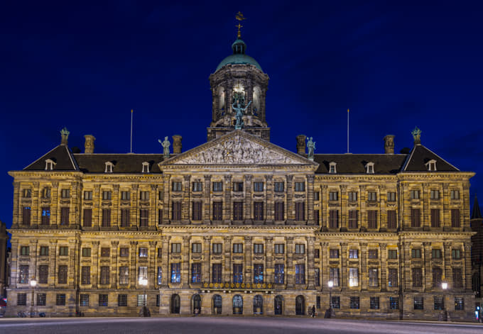 Admire the Royal Palace Amsterdam at Night.
