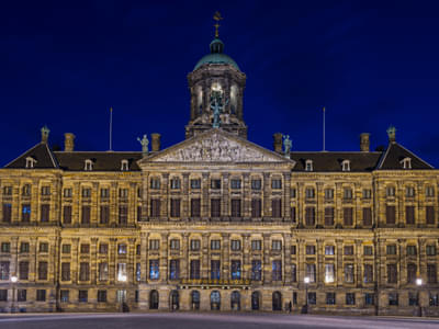 Admire the Royal Palace Amsterdam at Night.