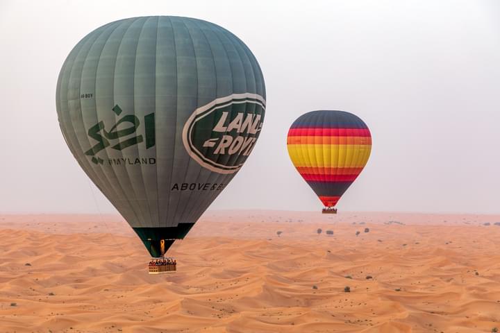 Two hot air balloons Flying Over Arabian Desert