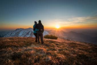 Couple admiring sunrise views in Manali