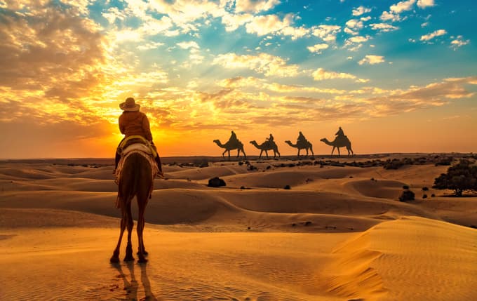 Female tourist on camel safari, Jaisalmer