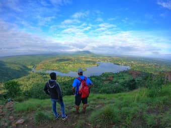 Trek through scenic trails lined with dense vegetation, granite boulders, and glimpses of the picturesque Thippagondanahalli Reservoir