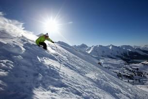 Learn skiing basics in just 10 minutes with expert guidance on Solang Valley's stunning slopes at 8,500 ft