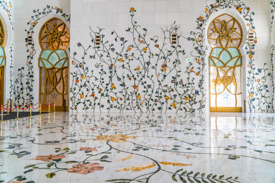 Admire the beautiful flower tiling at the mosque