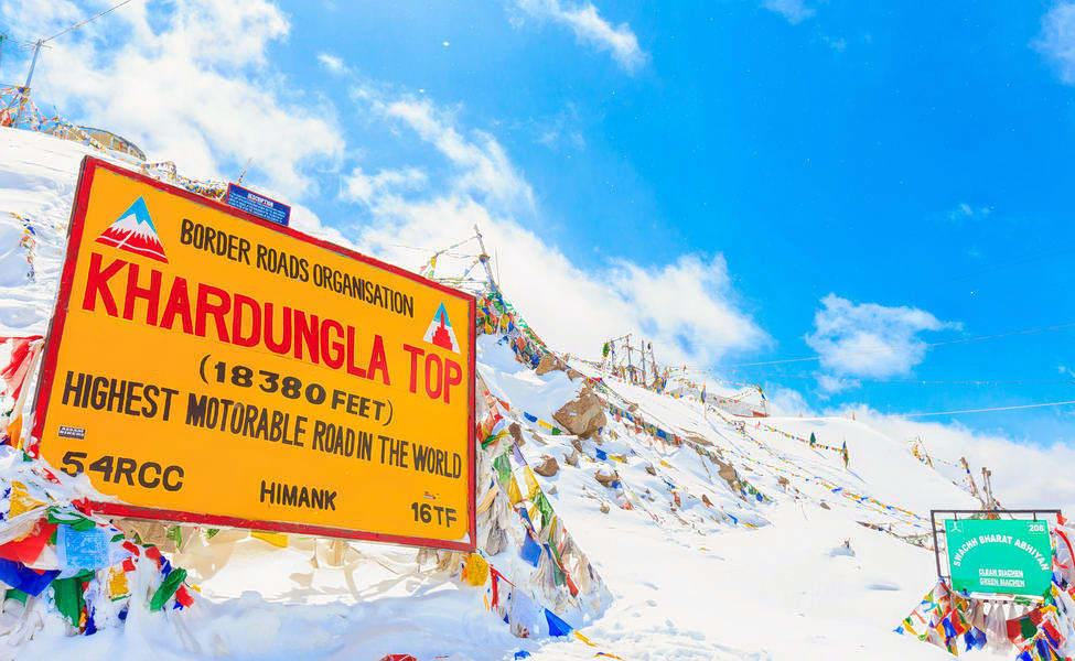 Experience the ultimate road trip to the heights of Khardung La, where breathtaking vistas await