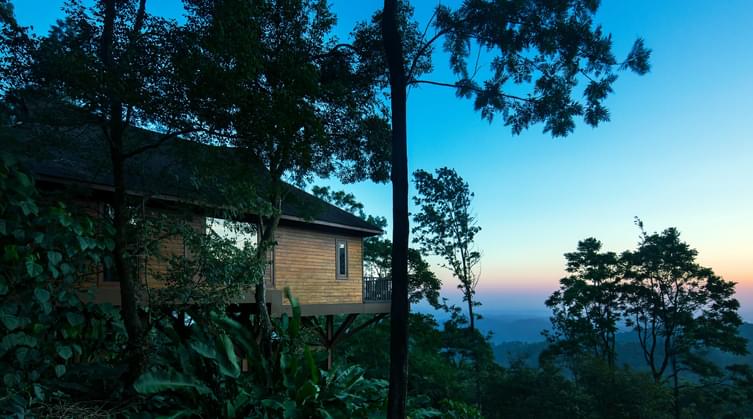 Stay in cottages overlooking the green valleys of Western Ghats