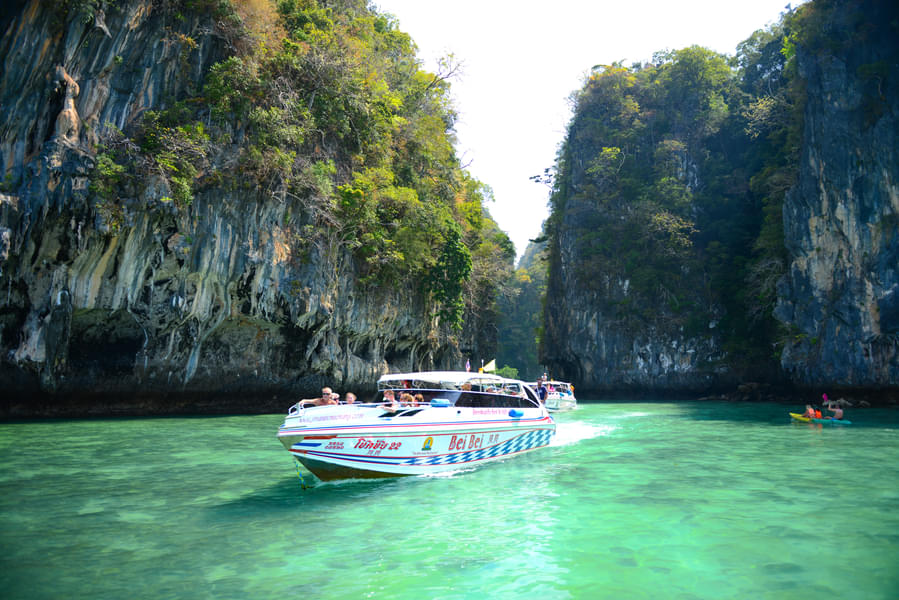 Hop on a speedboat and head to Phang Nga Bay