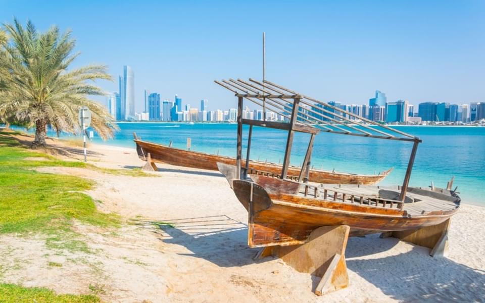 Walk through the beach in the Corniche admire city's skylines