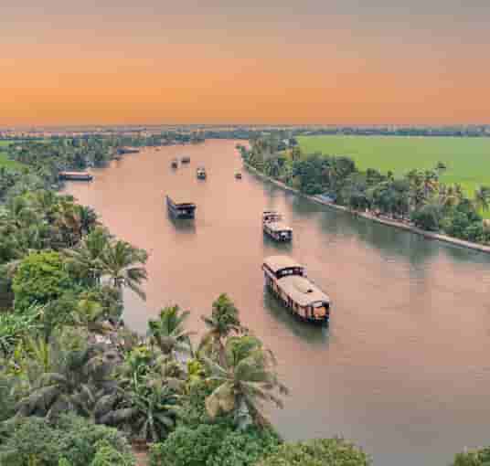 Enjoy a houseboat cruise through the backwaters of Alleppey