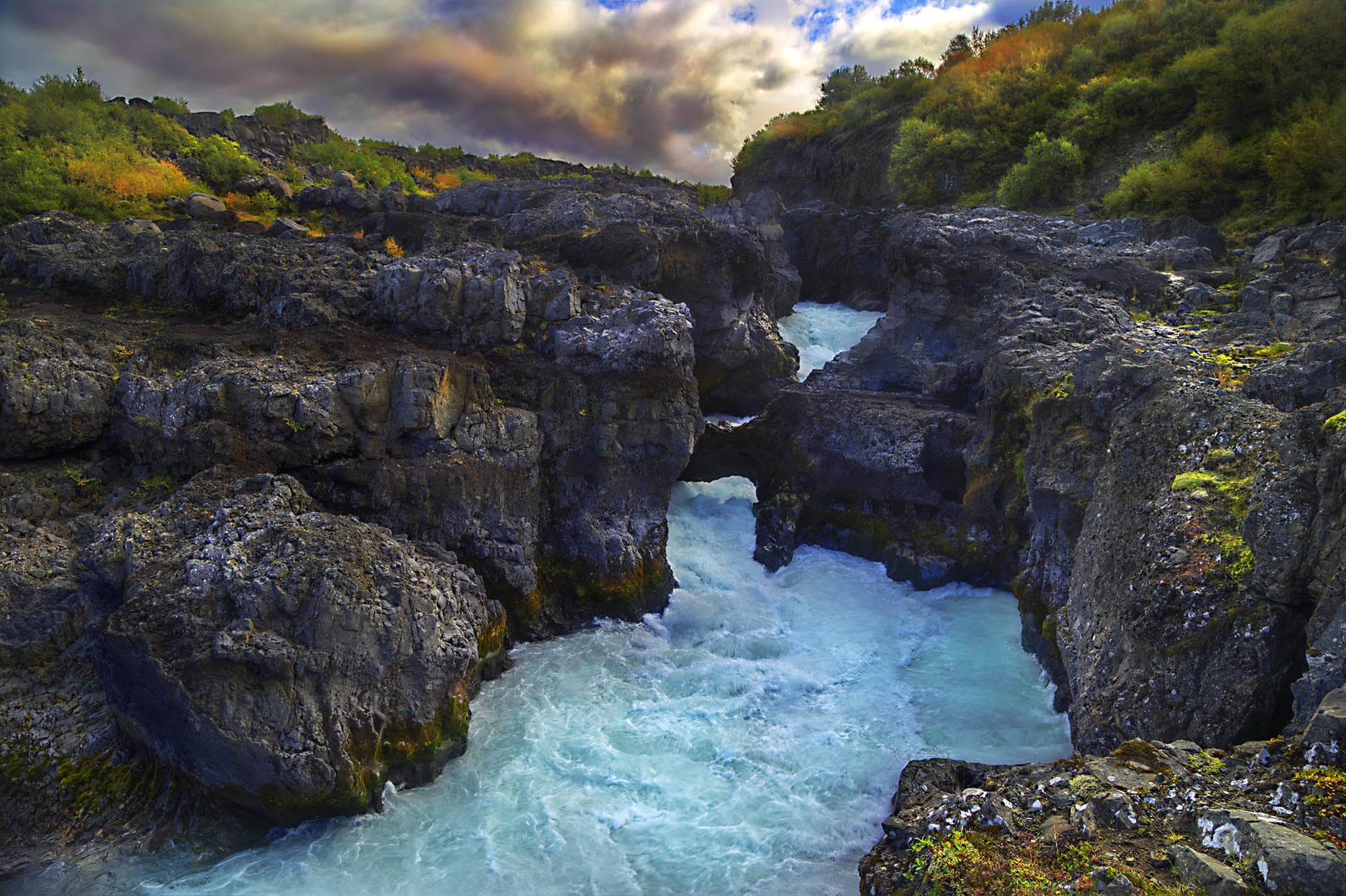 Marvel at the Hraunfossar and Barnafoss Waterfalls