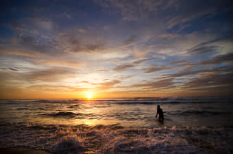 Walk along Marina Beach as the sun paints the sky.