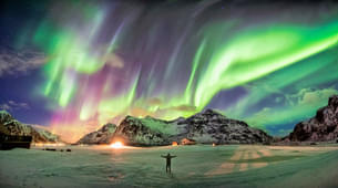 Tourist enjoying the view of Northern Lights