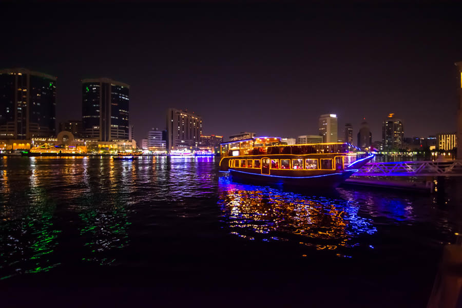 Immerse yourself in the stunning views of dazzling city lights from the boat