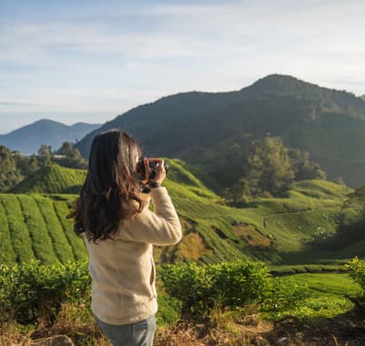 Tourist capturing images in Munnar